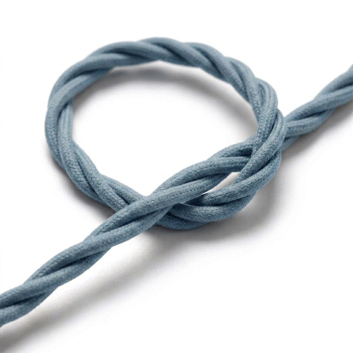 Close-up van het gedraaide strijkijzersnoer, katoen oceaanblauw
