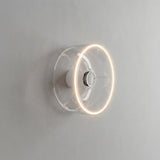 E27 led-donutlamp van helder glas, Ø 195 mm, brandend als wandlamp in een sober interieur